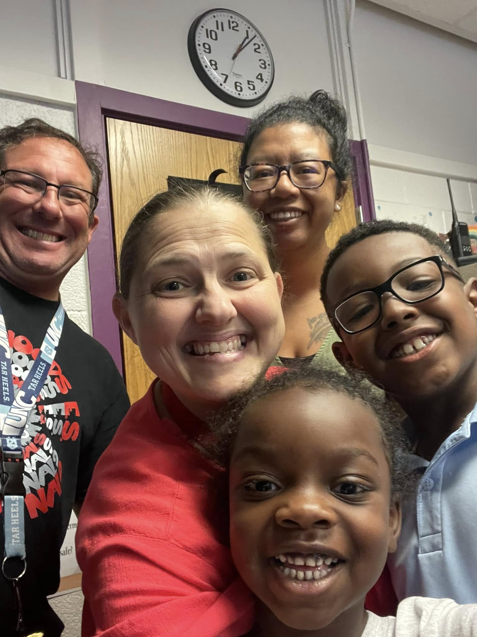 Kim with colleagues and students — captured in a classroom moment.